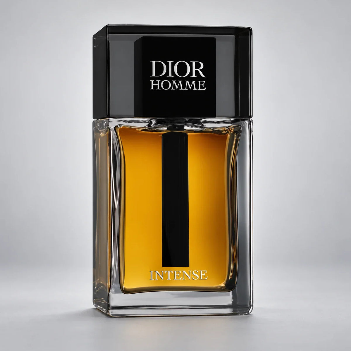 Dior Homme Intense bottle on clean gray background